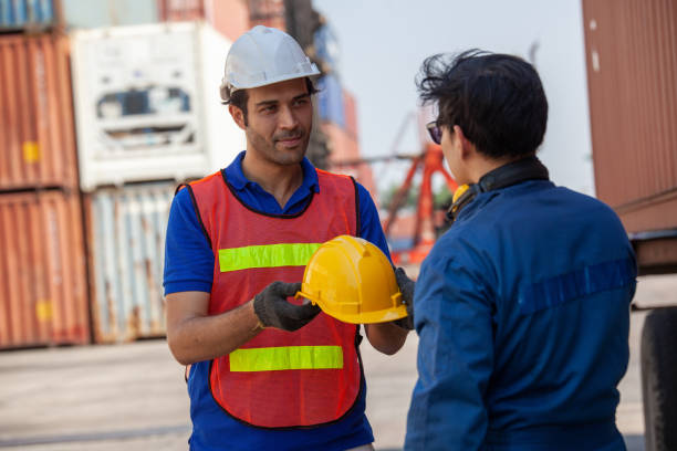 istock Foreman of container inspection workers prepare export products. Container Shipping Logistics Engineering of Import Export Transportation Industry 1307321886