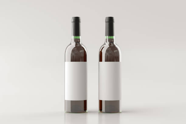 istock Two red wine bottles 750ml mock up with blank label on white background. 1307322686