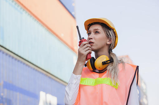 Worker Using Radio Female Worker Using Handheld Radio Receiver For Communication Stock ...