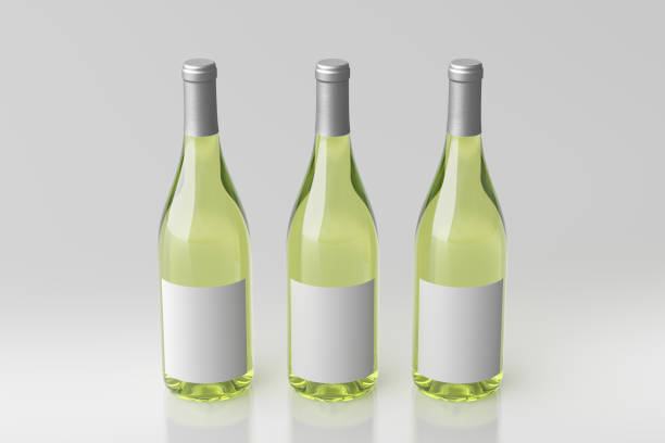 istock Three white wine bottles 750ml mock up with blank label on white background. 1307324279