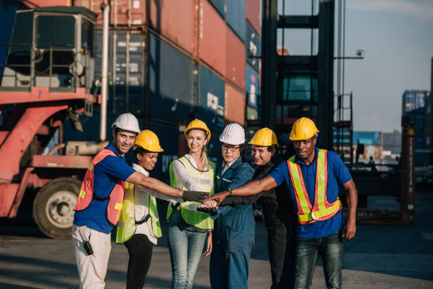 istock Workers Join Hand for Collaboration in the container yard. Business logistic concept, Import and export concept. Workers hands touching and Join Hand for Collaboration for successfully 1307324288