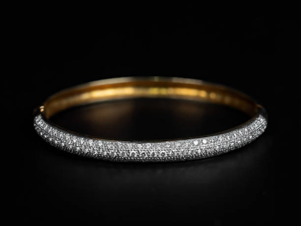 istock Close-up Gold Diamond Bracelet Isolated on Black Background 1307325274