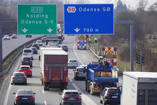 Traffic and warning signs on highway near Odense, Denmark