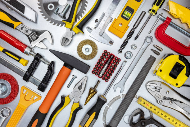 istock assorted work and home renovation tools. diagonal flat lay. concept industrial background 1307328937