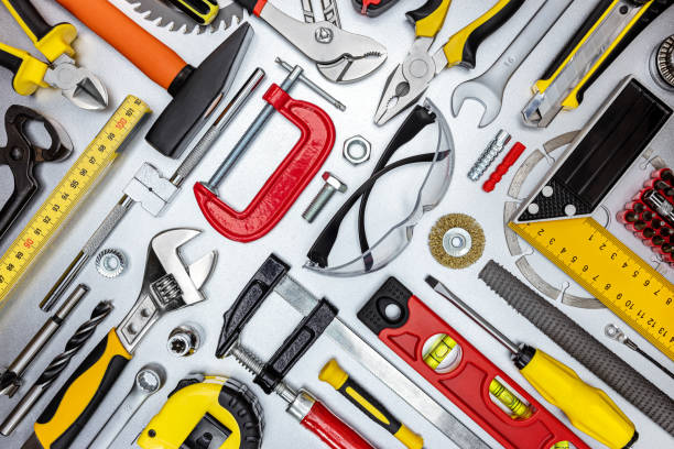 istock set of professional construction tools and safety glasses on metal workbench. top view 1307328942
