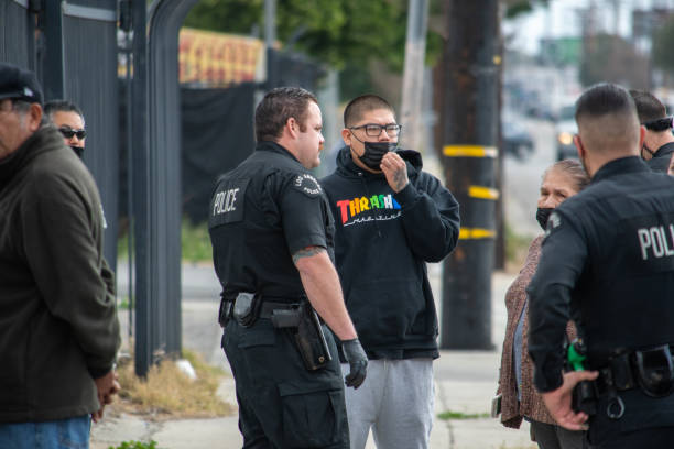 a diverse group of lapd officers and supervisors respond to an assault investigation in northridge, adjacent to a housing project on parthenia. - northridge imagens e fotografias de stock