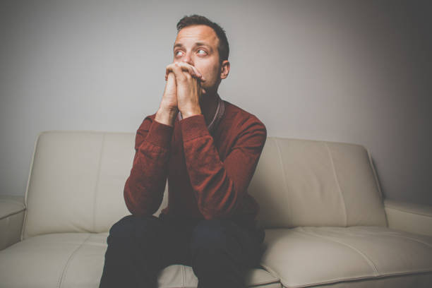 istock Handsome young man feeling thankful - praying to God 1307332194