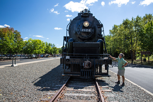 Senior man admiring the Union Pacific Big Boy Steam Locomotive X4012 in Scranton, PA