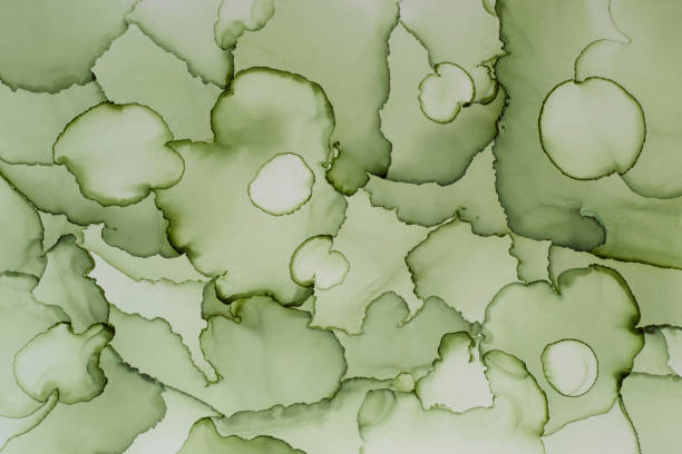 istock Green color abstract hand painted alcohol ink texture 1307335034