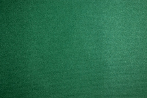 Blank background texture of green velvety paper. Design layout. Copy space