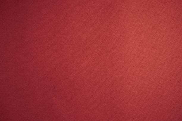istock Blank background texture of red velvety paper. Design layout. 1307336293