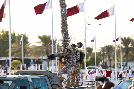 Doha, Qatar - December 18, 2017: Perform of military vehicles on National Day parade on the Corniche street, Doha, Qatar
