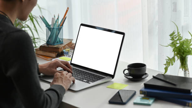 istock Young man freelancer working with laptop computer in home office. 1307338184