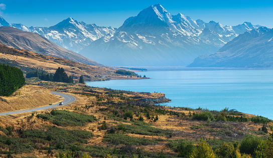 View of the road towards to Mount Cook along the turquoise Lake Pukaki. South Island, Canterbury, New Zealand