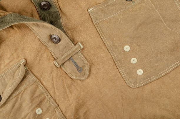 istock A crumpled brown shirt with a pocket and buttons. 1307339297