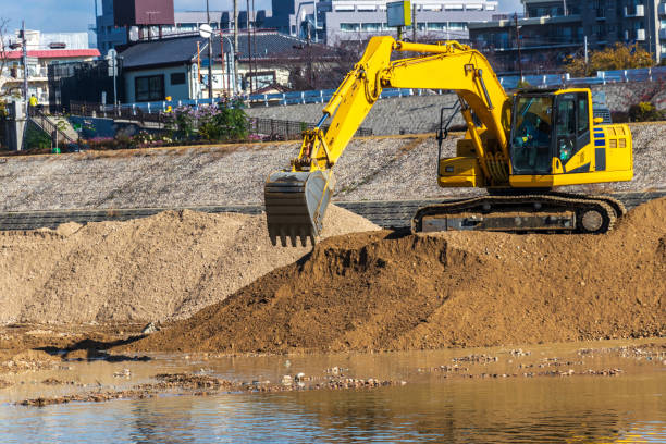 istock Hydraulic excavator digging up the sand in the river 1307340657