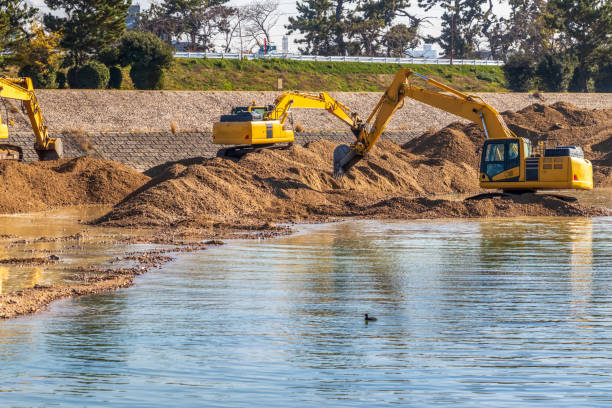 istock Hydraulic excavators digging up the sand in the river 1307341204