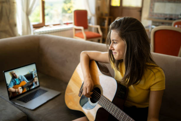 istock Online guitar lesson at home 1307341526