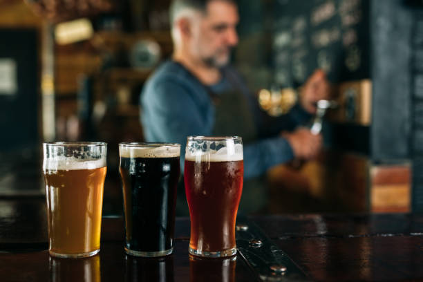 istock barman serving beer in pub 1307342508
