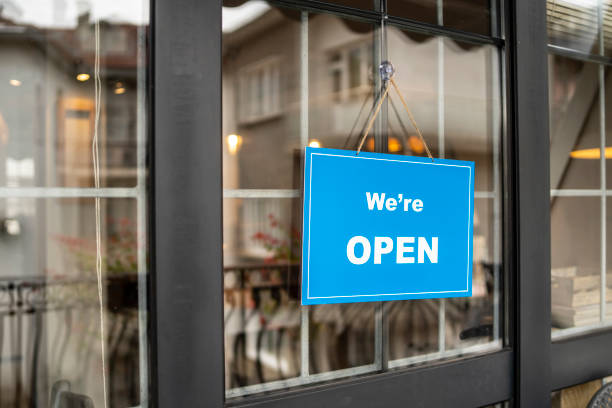istock We're open Sign on a restaurant or cafe entrance 1307342513