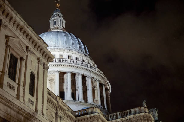 Low angle view of illuminated St. Paul's Cathedral dome in London against dark night sky