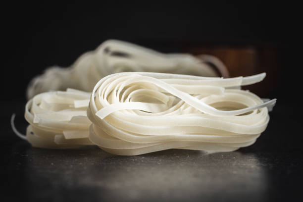 istock Dried white rice noodles. Raw pasta. Uncooked noodles. 1307344127