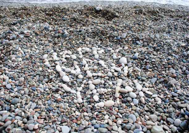 istock lettering sea pebbles happy new year 1307344936