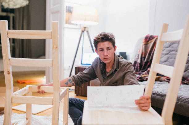 istock Assembling furniture in new apartment 1307346303