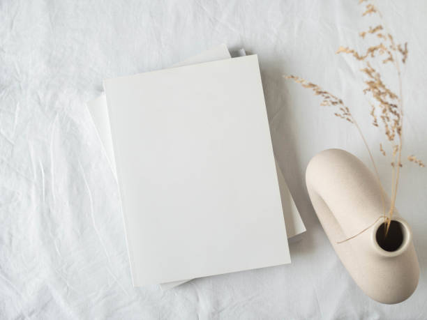 istock Empty blank white magazine cover mock up and ceramic vase with dried grass 1307346864