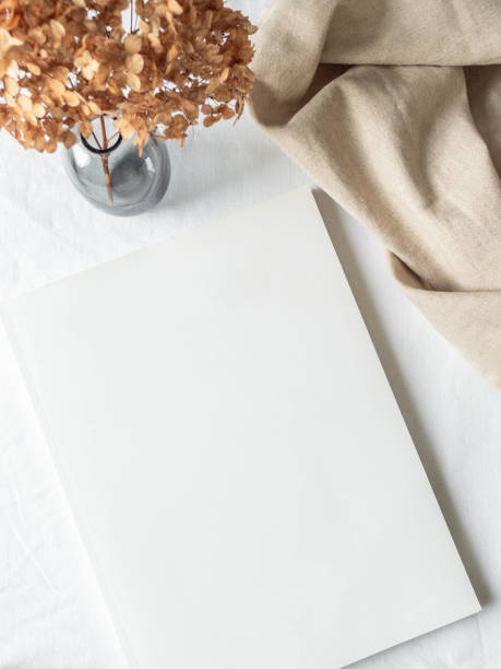 istock Empty blank white magazine cover mock up and vase with dried flower 1307346887