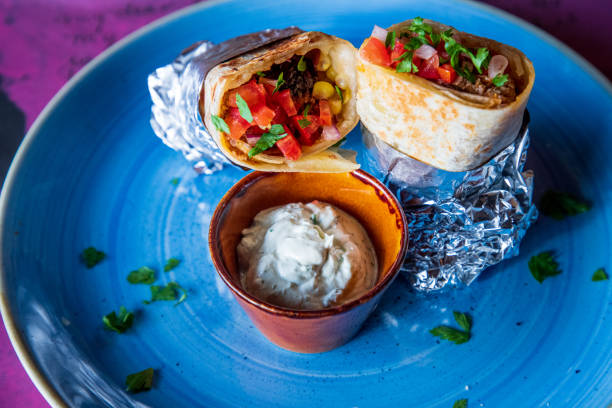 istock Burritos with dipping sauce on a plate 1307347390