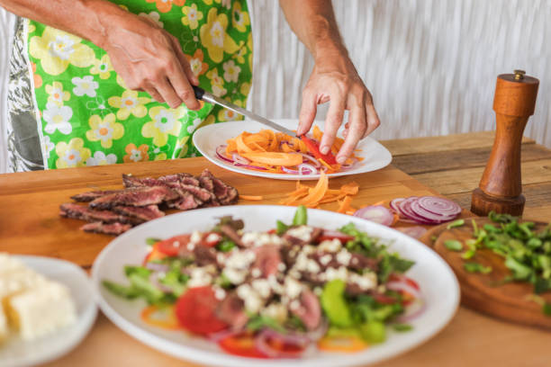 istock Meat salad with vegetables preparing 1307348641