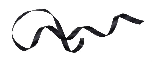 istock Waved black silk ribbon isolated on white 1307349512