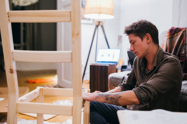 istock Assembling furniture in new apartment 1307350191