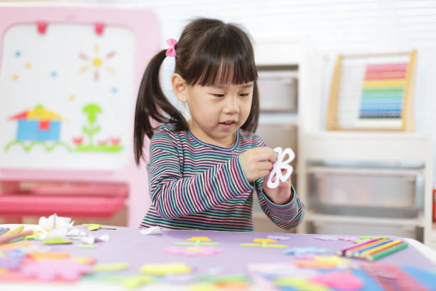 istock Young Girl Making Craft For Homeschooling 1307353265