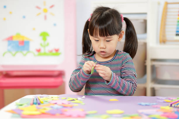 istock Young Girl Making Craft For Homeschooling 1307353267