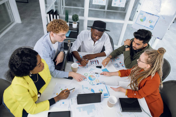 istock Multiracial students, designers or IT specialists working with graphs and charts 1307356096