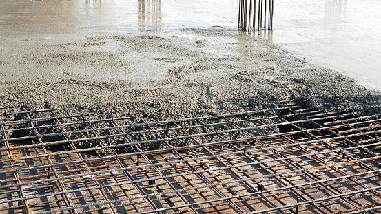 Closeup of steel reinforcement on the floor for pouring concrete. Construction of new residential high-rise buildings.