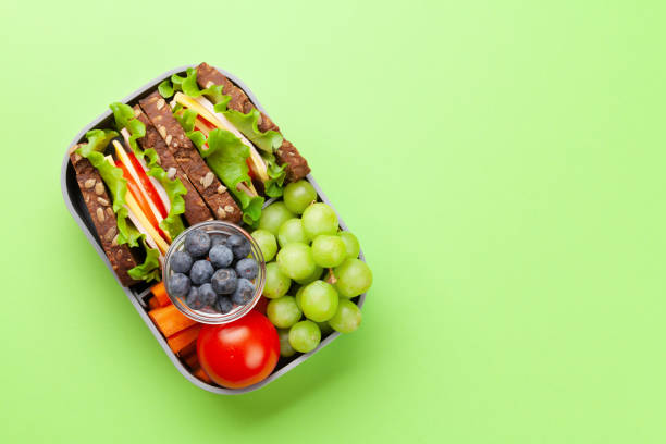 istock Healthy school lunch box with sandwich and fresh vegetables 1307356593