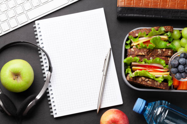 istock Healthy office lunch box with sandwich and fresh vegetables 1307356687