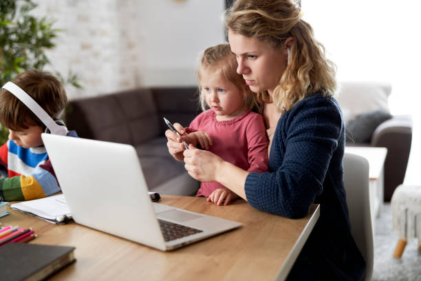 istock Mother during home office with little daughter on her lap 1307356705