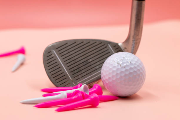 istock Golf ball is on pink background for lady tournament 1307358607