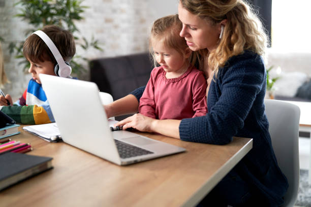 istock Mom trying to work from home with children 1307360196