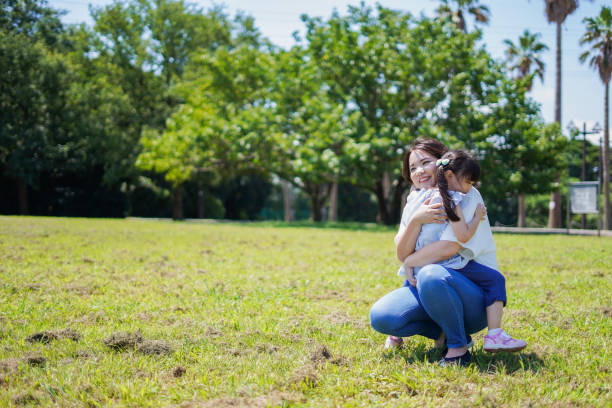 istock Mother holding a small child in her arms 1307361423