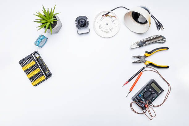 istock cctv camera service repair concept. above view. adjusting surveillance camera using tools on white desk 1307361781