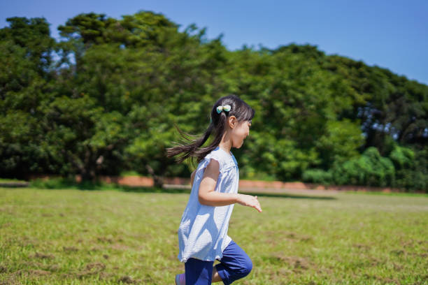 istock Little girl running around outside 1307362504
