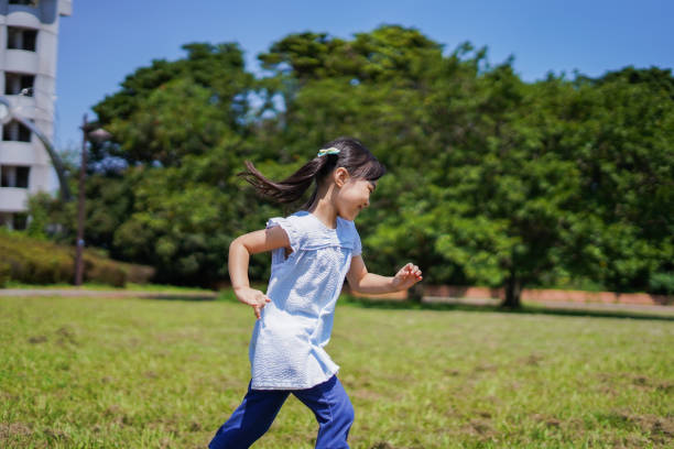 istock Little girl running around outside 1307362505