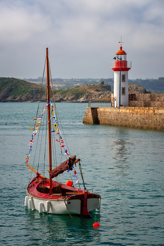 View of the picturesque harbor and lighthouse of Erquy, Côtes d'Armor, Brittany, France