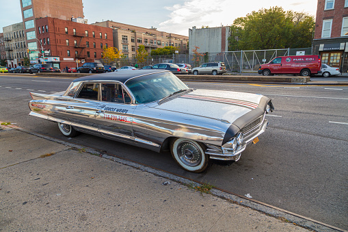 New York, USA - OCT 26, 2015: chrome classic car in Brooklyn with ads for vehicle wraps at the street in New York, Brooklyn.