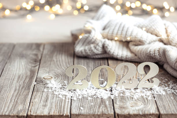 istock Cozy festive composition with the numbers 2022 on a wooden surface. 1307365360